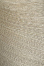 Close-up of a textured beige hair extensions surface with horizontal lines
