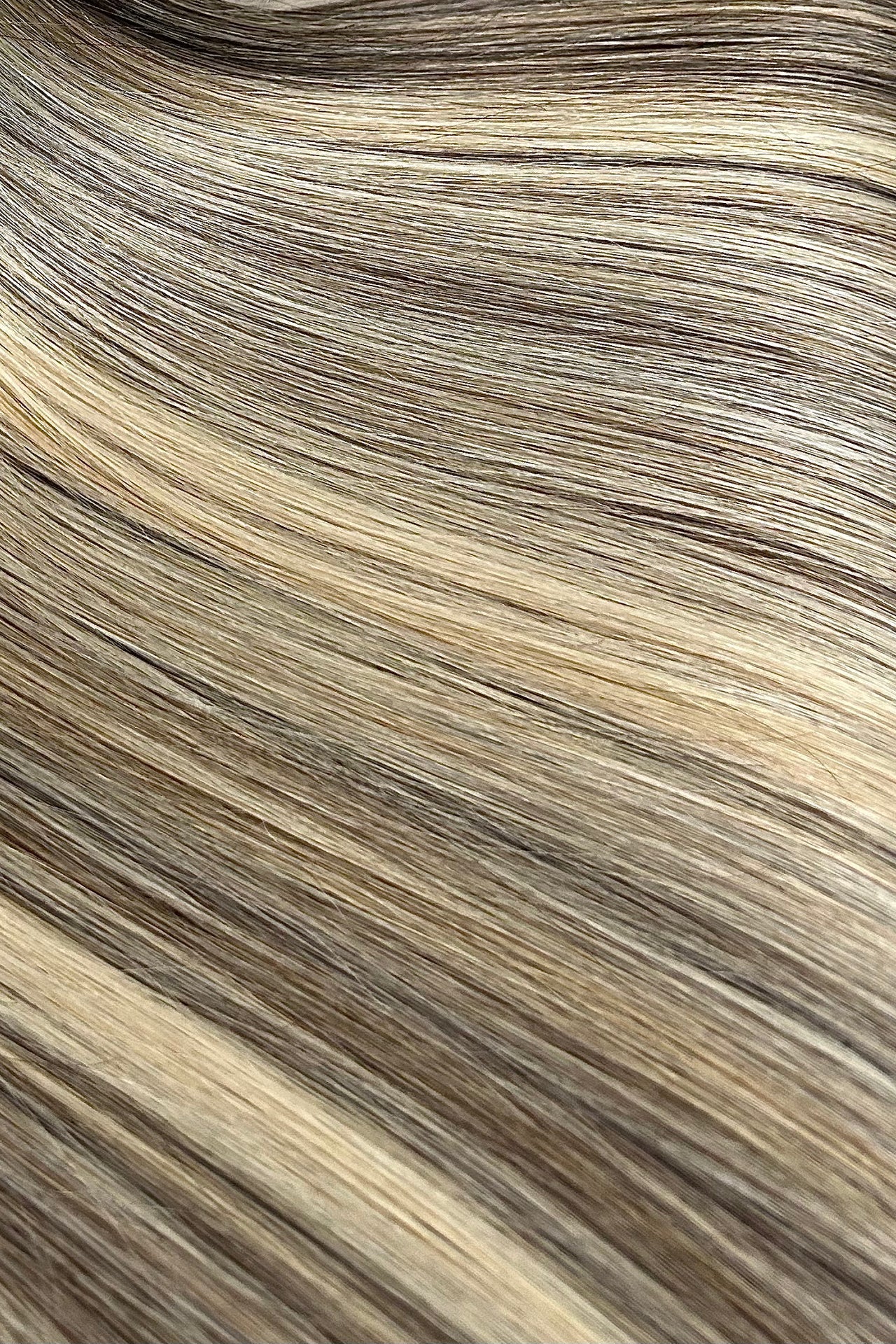 Close-up of brown and blonde hair extensions