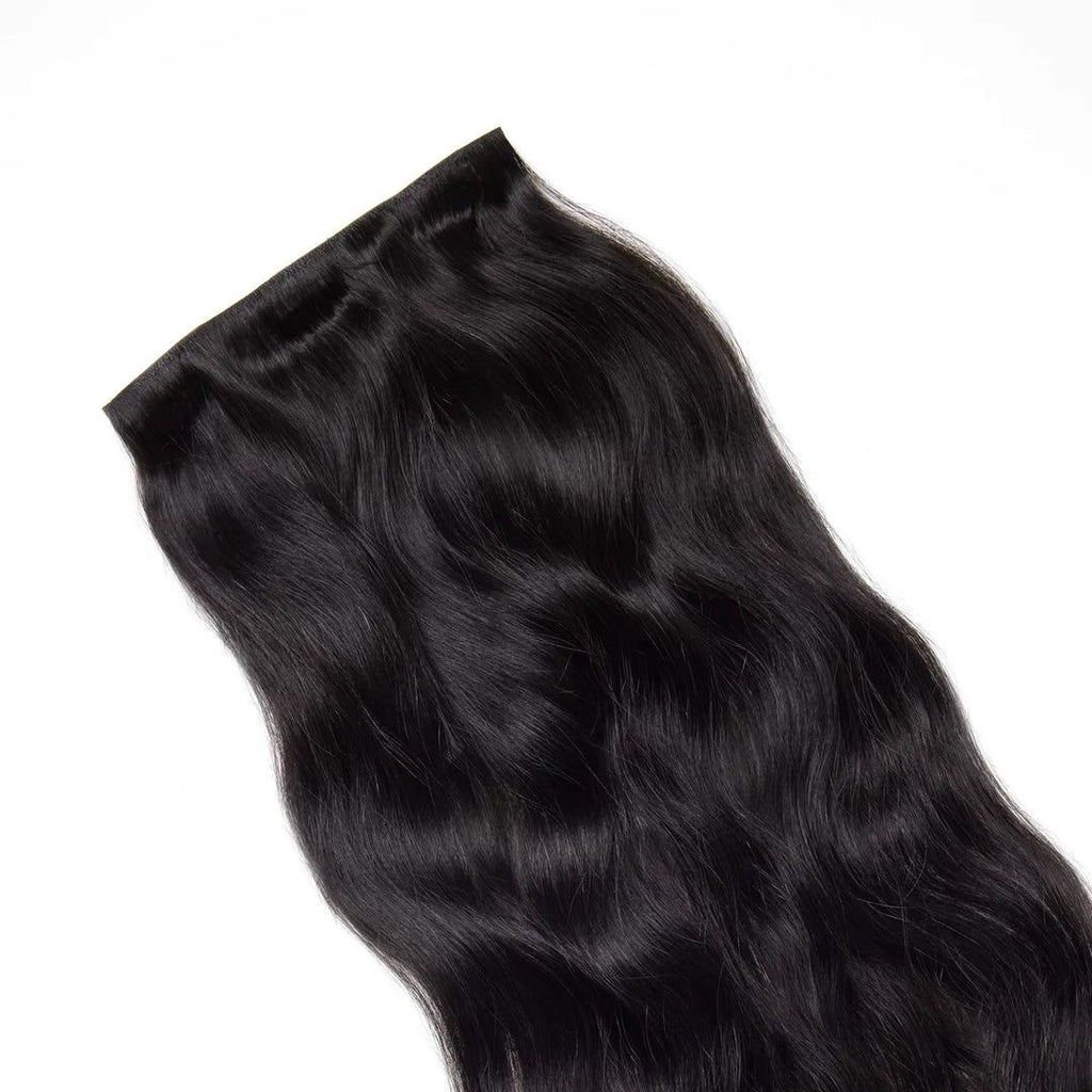 Black hair extensions on a white background