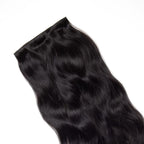 Black hair extensions on a white background
